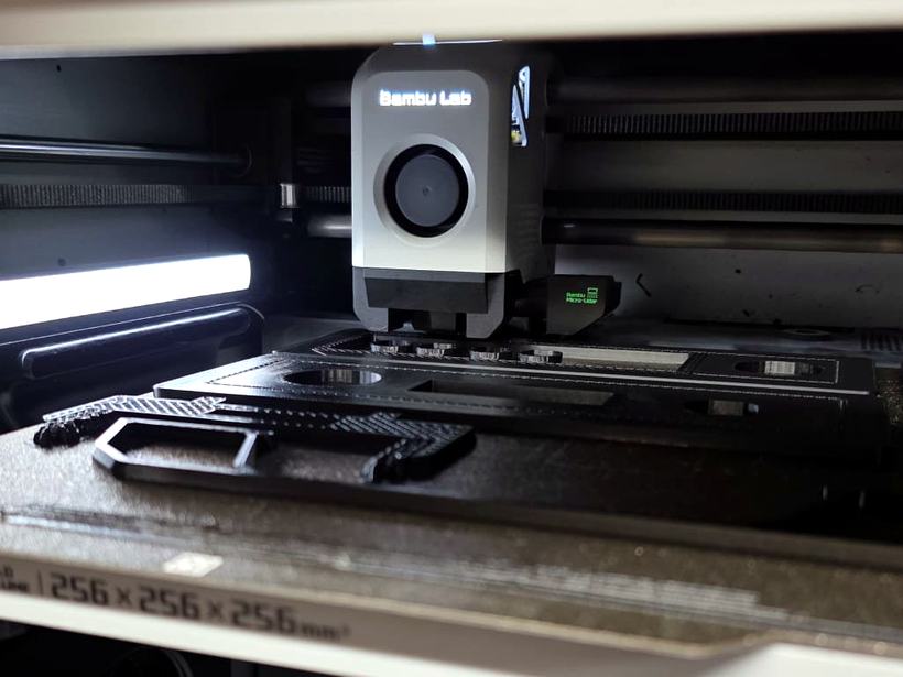 Production parts mid-print on the build plate
